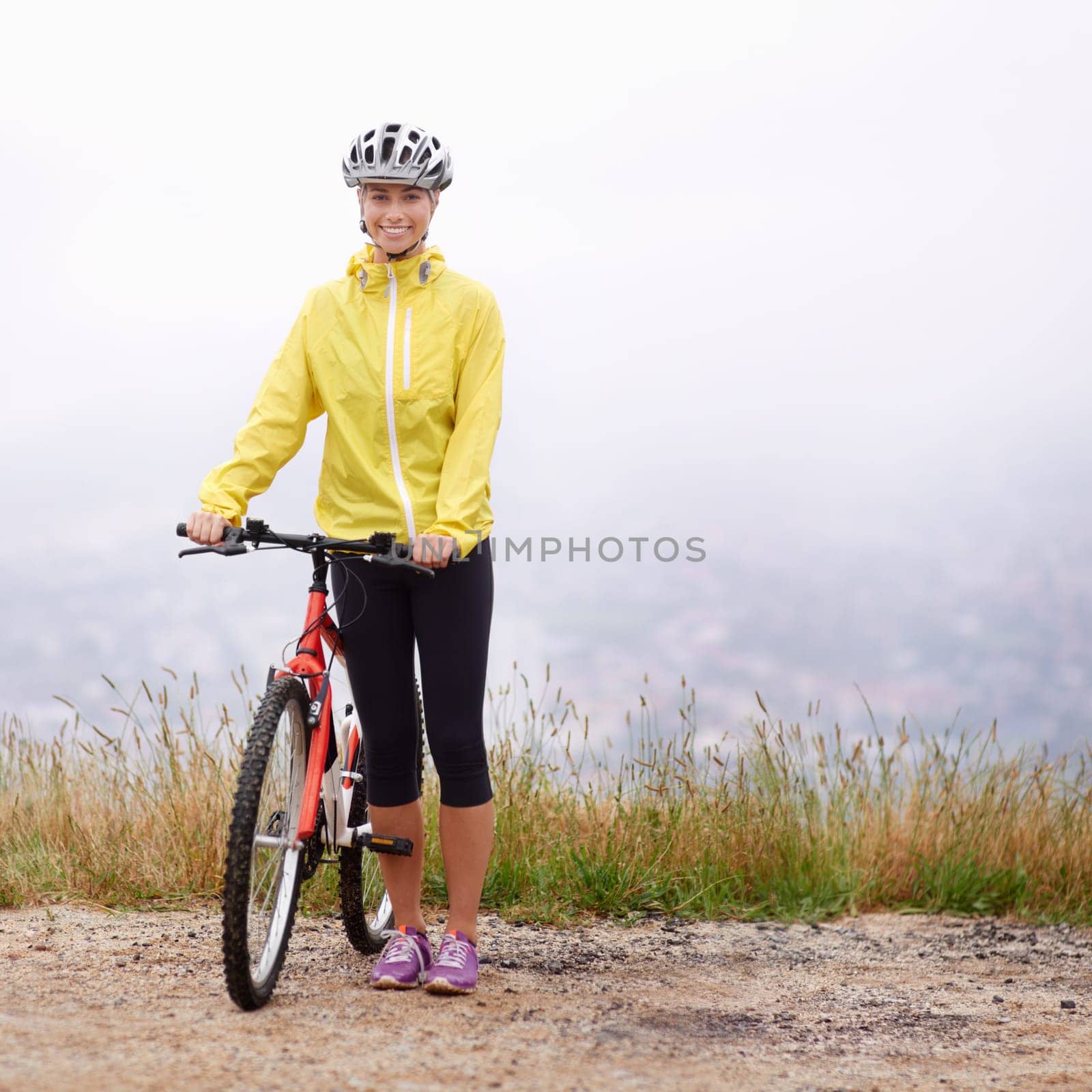 Portrait, smile and woman with bike in mountains for morning exercise, training or off road hobby. Cycling, fitness and sports with happy young athlete in countryside or nature for workout ride.