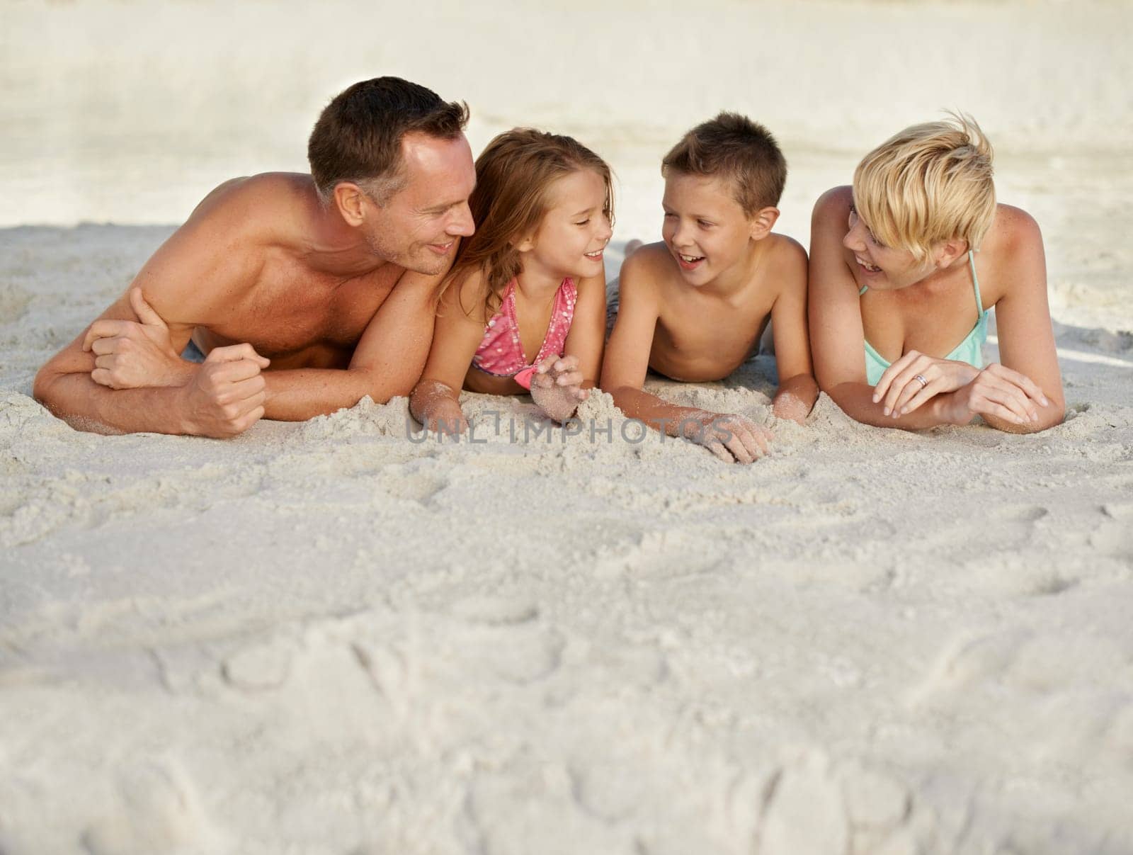 Family, kids and beach with adventure in summer on vacation for bonding and happiness in Florida. Parents, smile and travel for holiday with children to relax, fun and enjoy trip in seaside