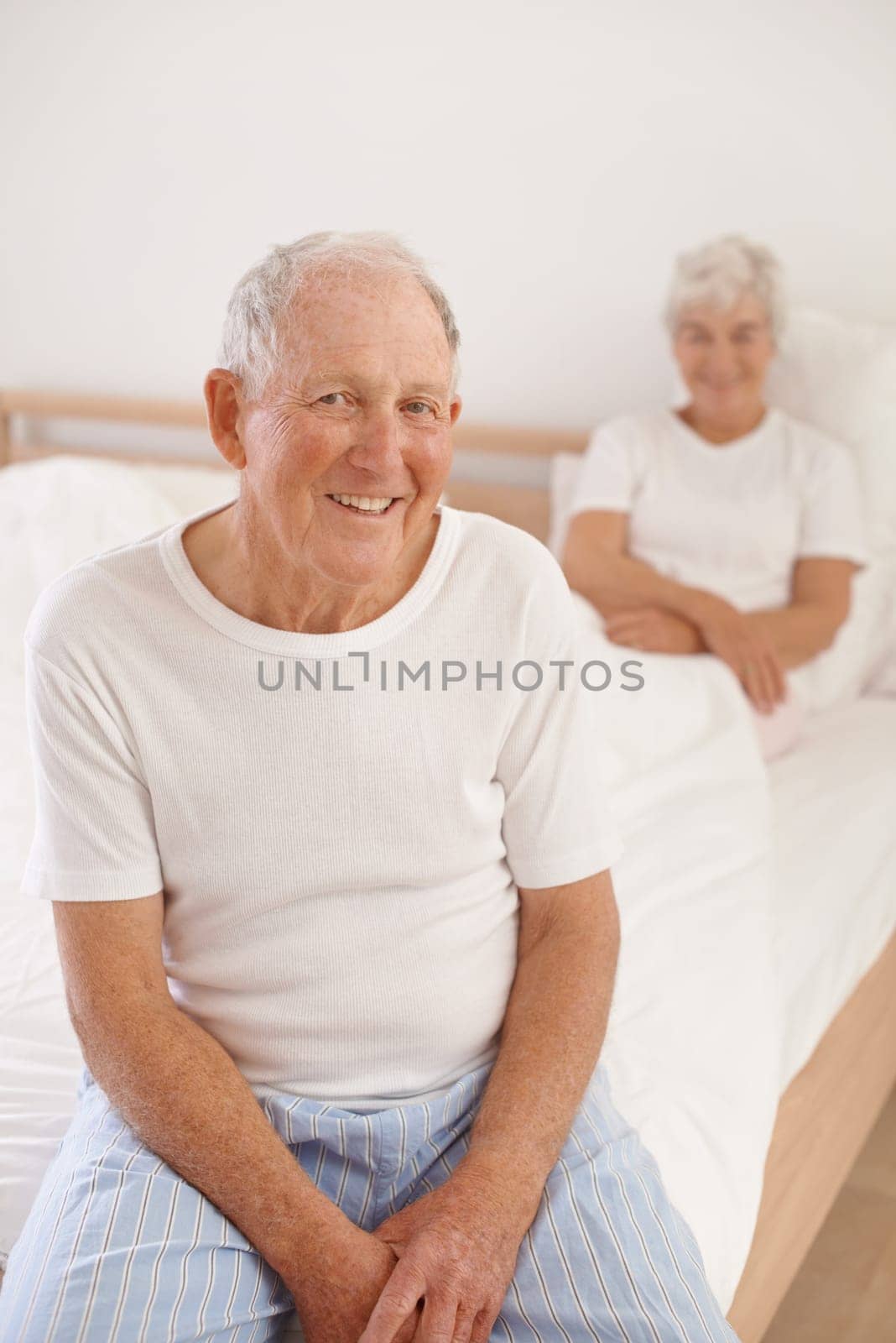 Senior man, couple and portrait in bed, smile and relaxing together in retirement at home. Elderly people, bedroom and happy in marriage or relationship, love and bonding for romance on weekend by YuriArcurs