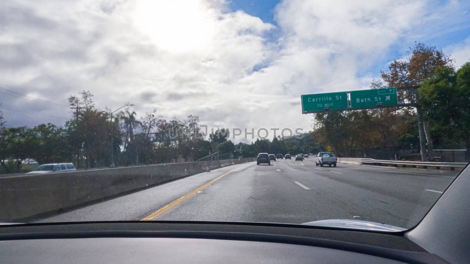 Los Angeles, California, USA-December 4, 2022-POV-Driving on HWY 101 near Santa Barbara, California, the road is shrouded in cloudiness during winter, creating a moody atmosphere while still showcasing the beauty of the coastal landscape.