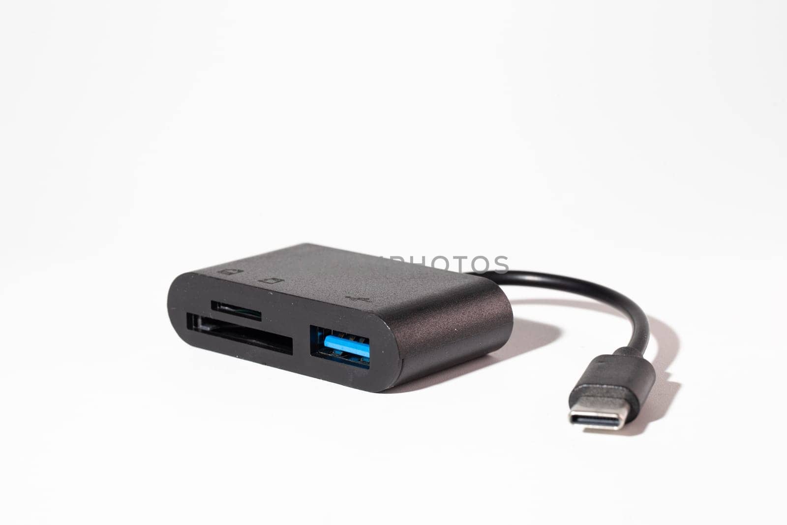 Black USB Type-C 3.1 multi-card reader adapter with short cable for data transfer, isolated on white background. Ideal for tech setups.