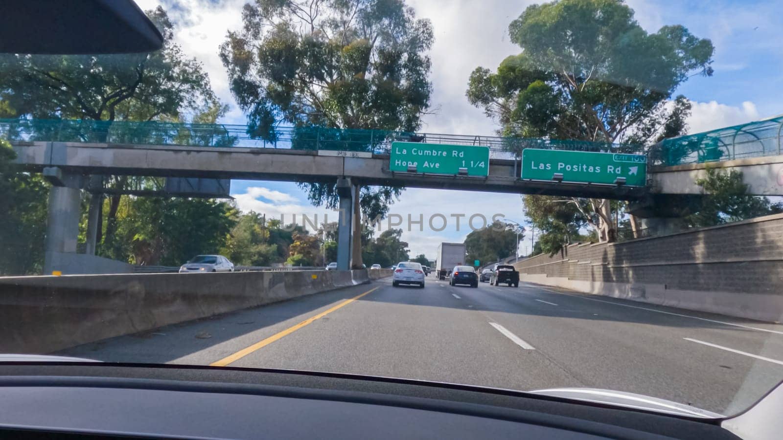 Los Angeles, California, USA-December 4, 2022-POV-Driving on HWY 101 near Santa Barbara, California, the road is shrouded in cloudiness during winter, creating a moody atmosphere while still showcasing the beauty of the coastal landscape.