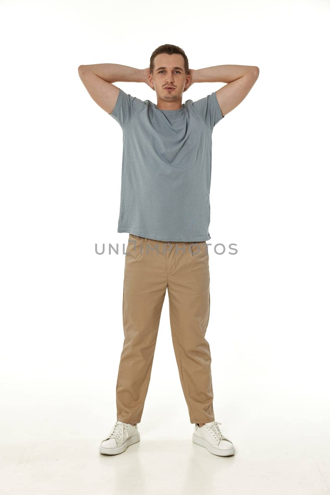 handsome young calm man on white background