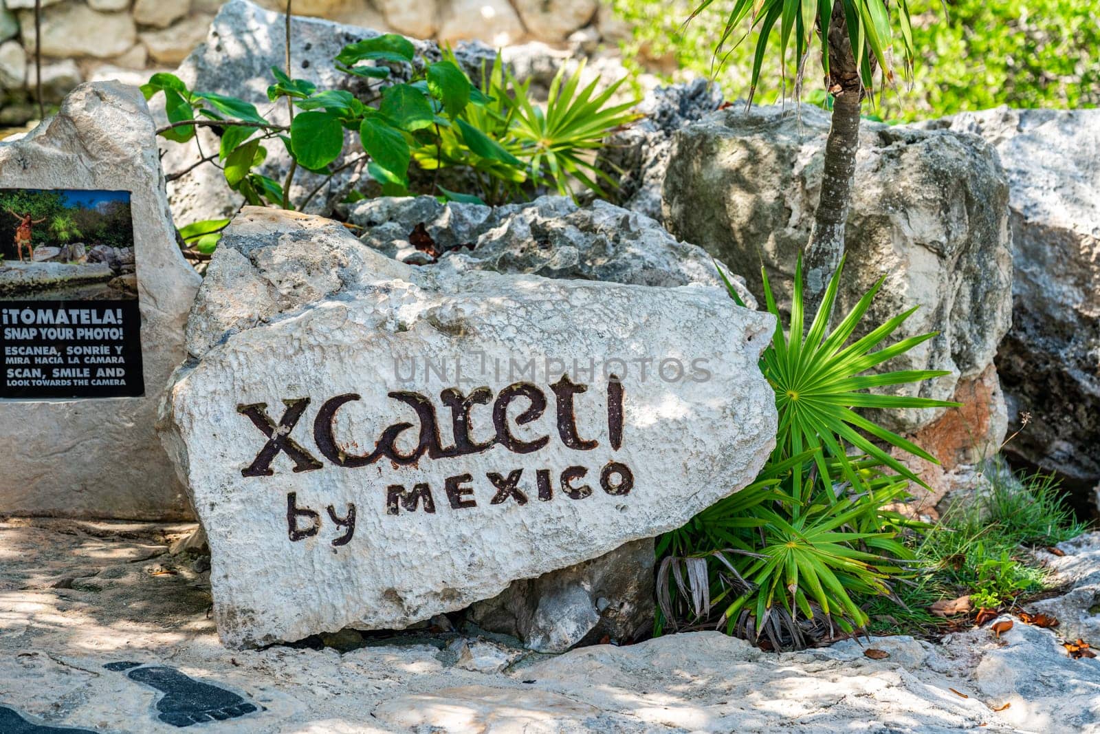 Cancun, Mexico - September 13, 2021: Xcaret theme park sign on a big stone in Mexico