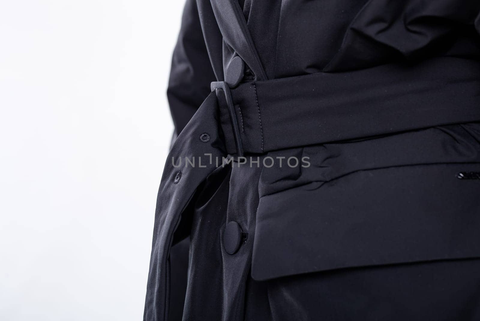 Close-Up of Woman Fastening Black Blazer Belt with Elegance and Style by Pukhovskiy