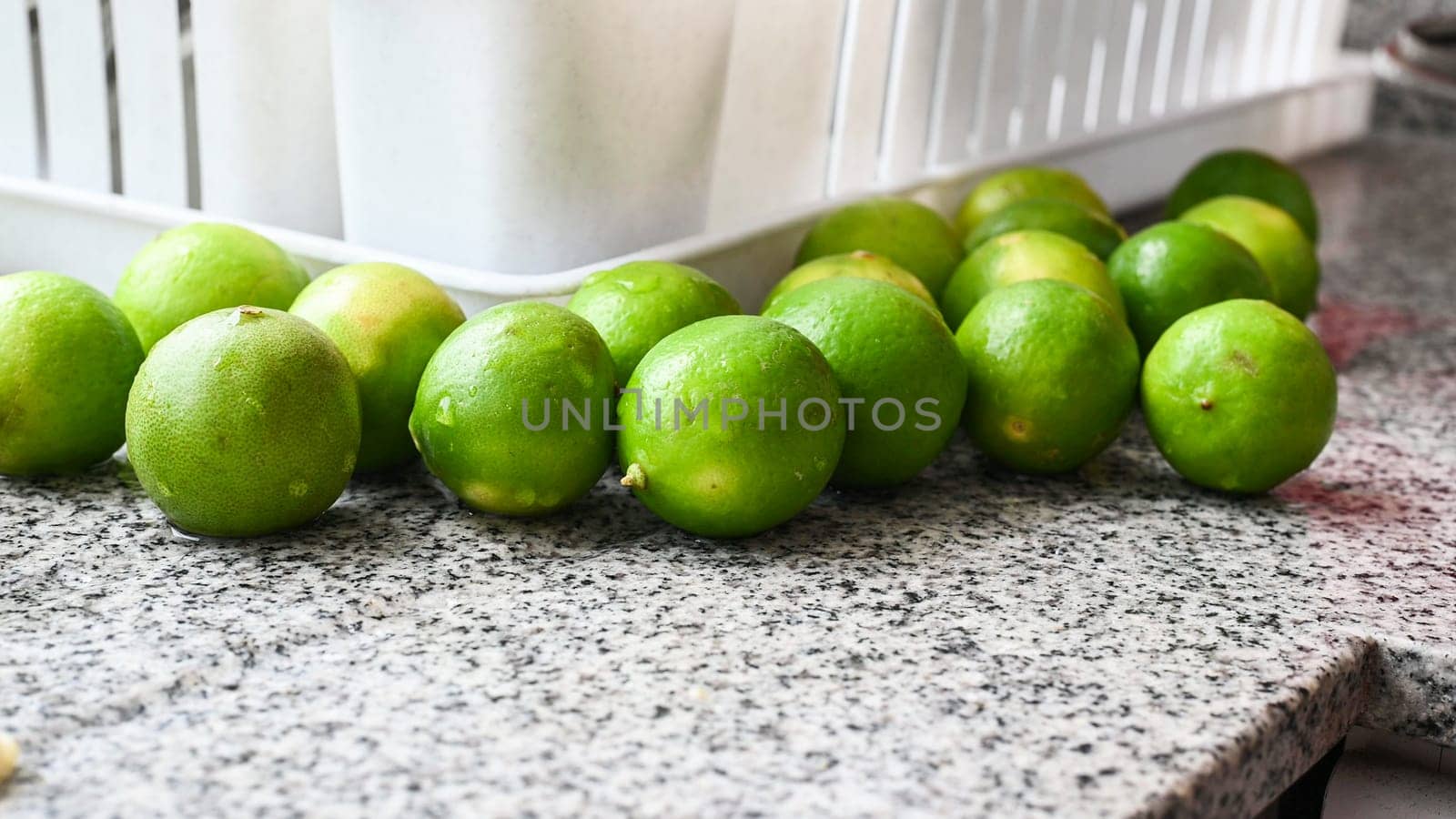 Slow shot of fresh Peruvian lemons ready for various dishes. by Peruphotoart