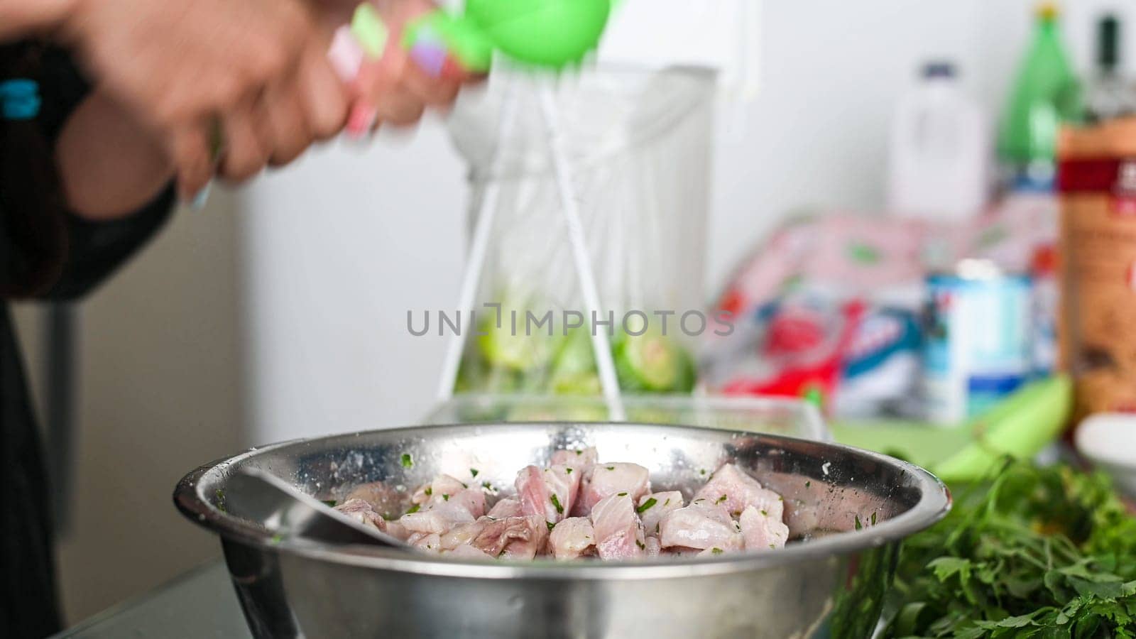 Peruvian food ceviche. 4 Preparation of ceviche, squeezing lemon juice over the ceviche. by Peruphotoart