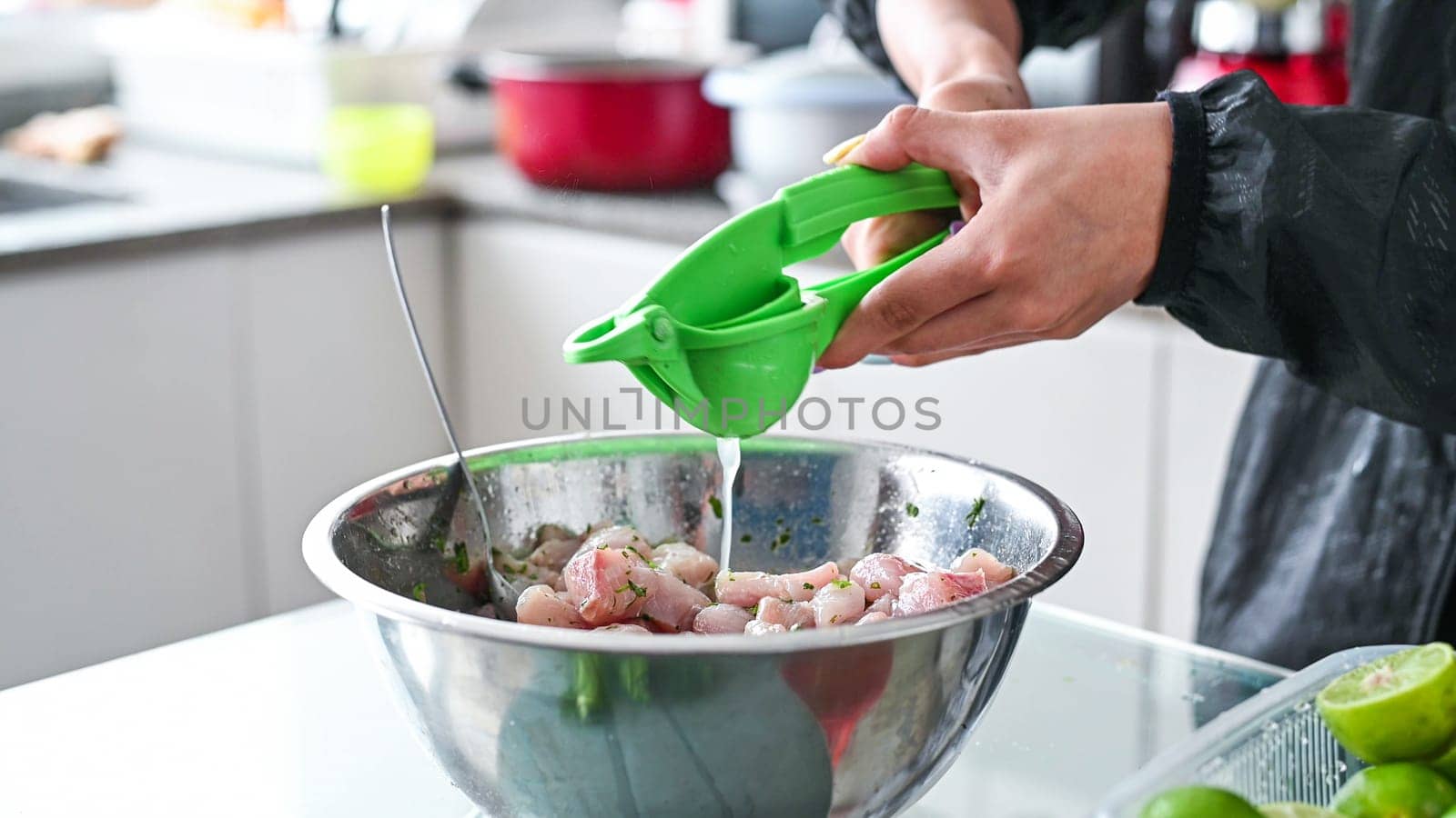 Peruvian food ceviche. 4 Preparation of ceviche, squeezing lemon by Peruphotoart