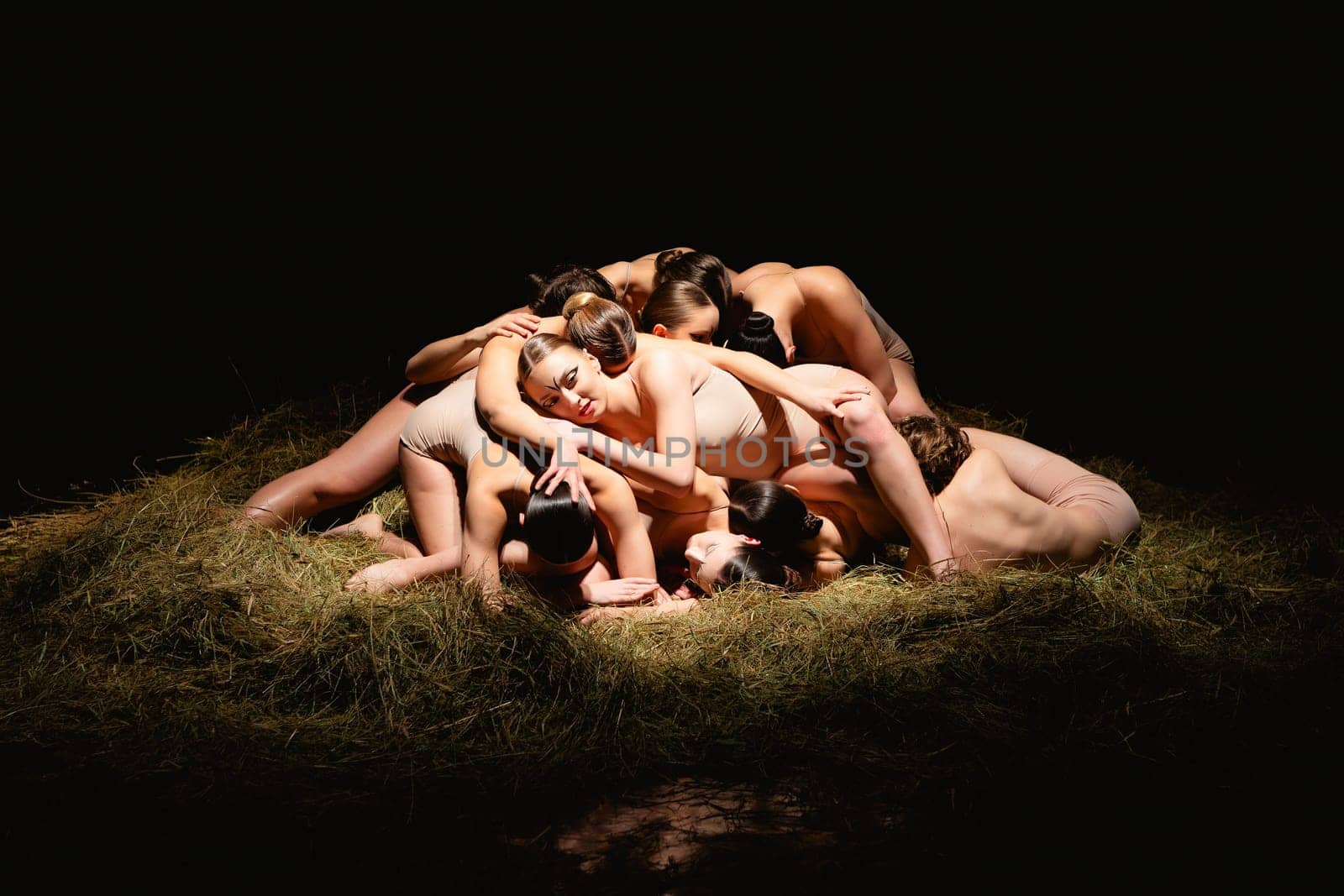 Group of modern ballet dancers. Contemporary art. Young flexible athletic men and women. Concept of dance grace, inspiration, creativity. Group of 11 models.