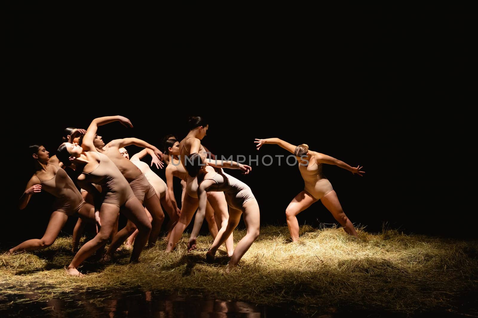 Group of modern ballet dancers. Contemporary art. Young flexible athletic men and women. by sarymsakov