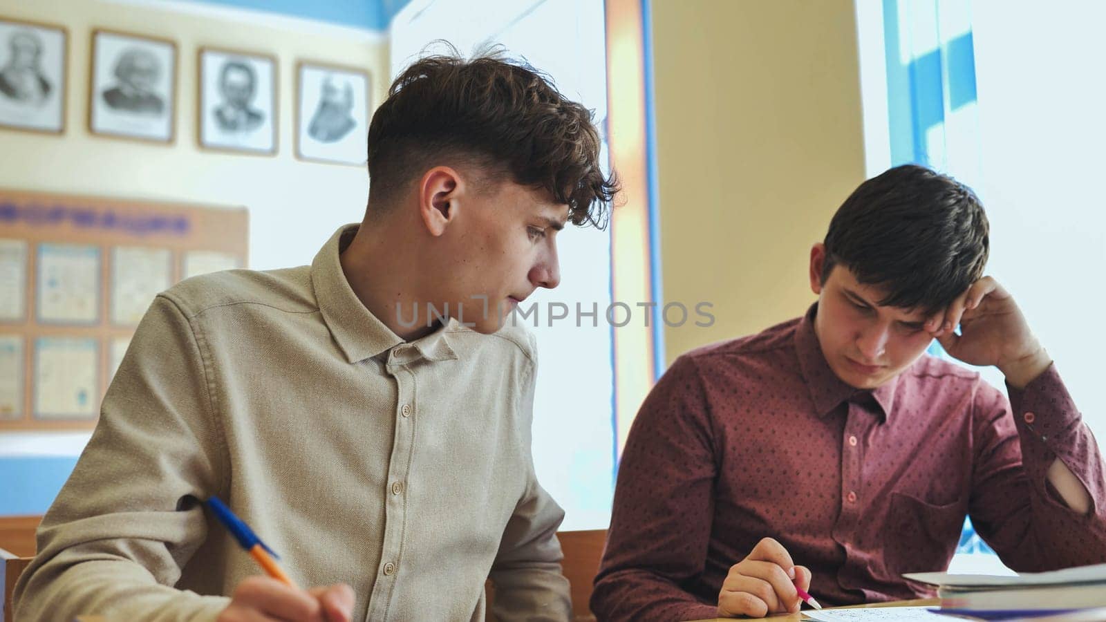 Schoolboys at a desk during class