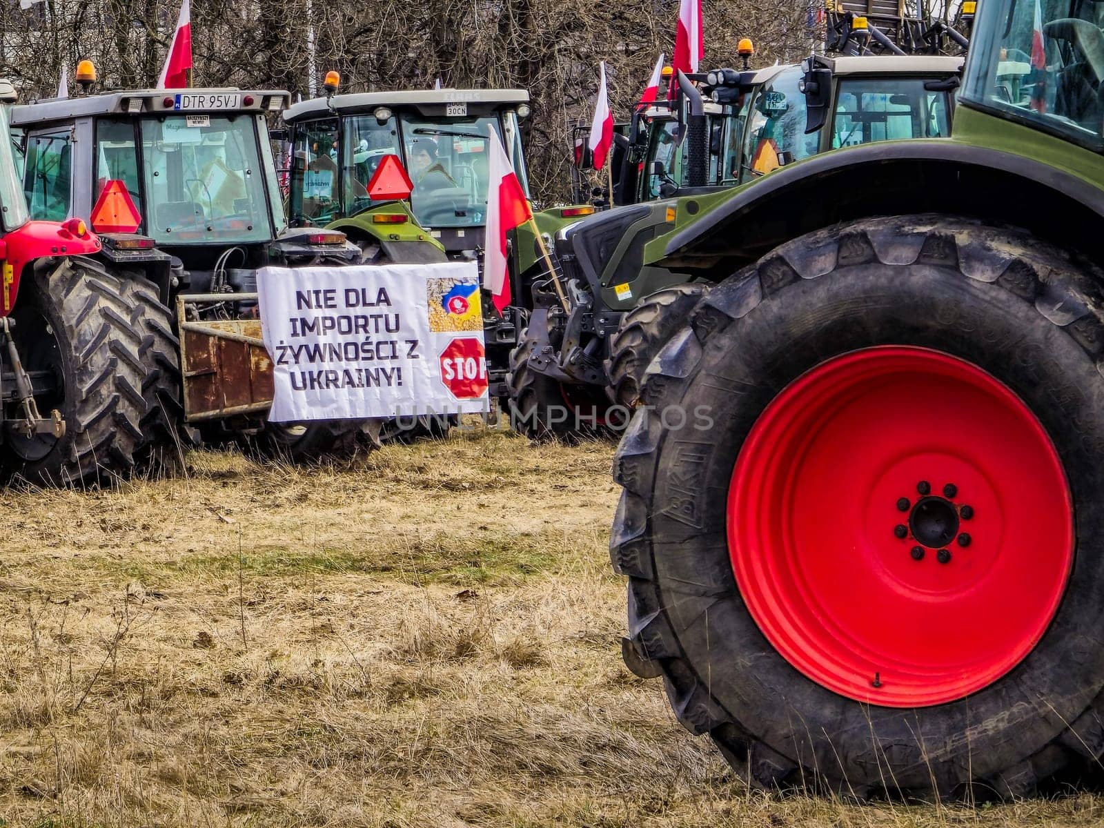 Wroclaw, Poland, February 15, 2024: Protesting farmers with banners on tractors, slogan: "No to food from Ukraine - STOP".