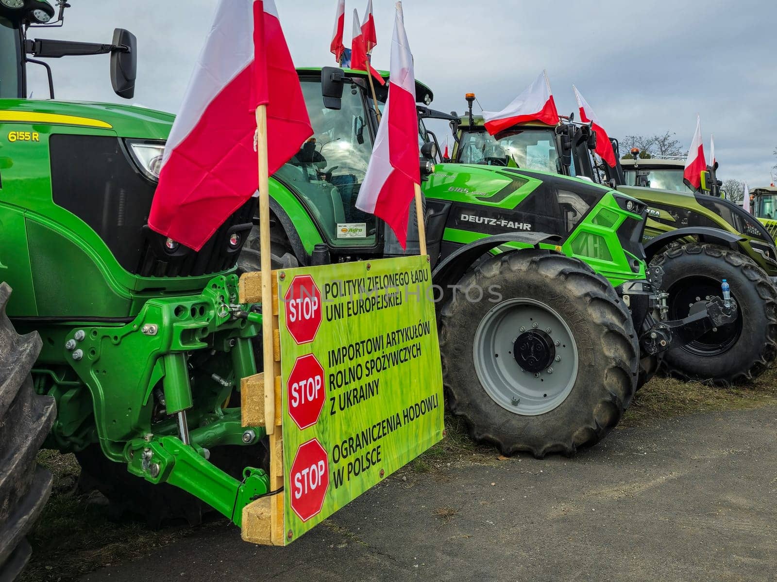 Wroclaw, Poland, February 15, 2024: Tractors at a protest with banners, slogan: "STOP the European Union's green government policy, STOP imports of agricultural and food products from Ukraine, STOP restrictions on breeding in Poland."