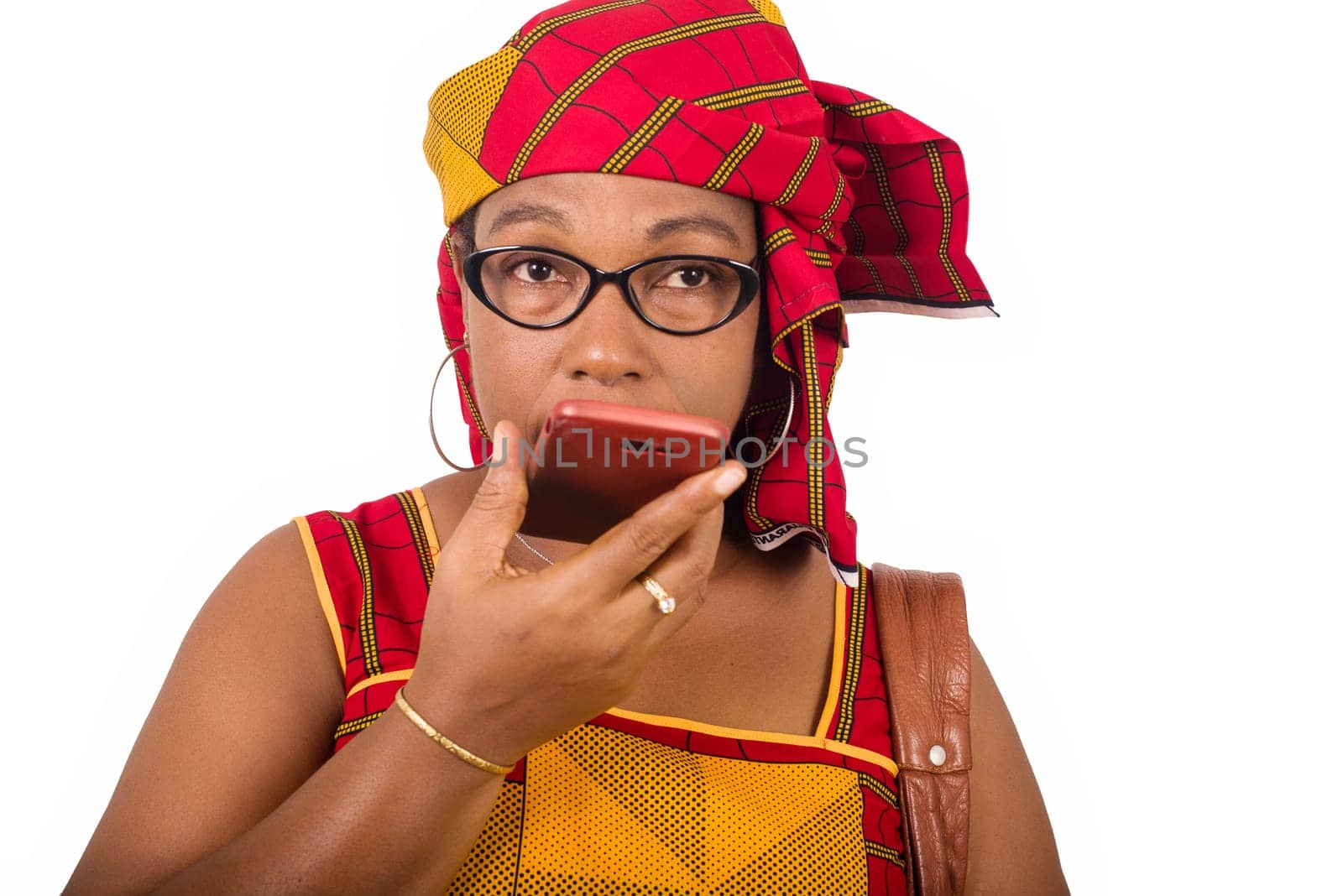 mature woman in loincloth standing on white background communicating to mobile phone.