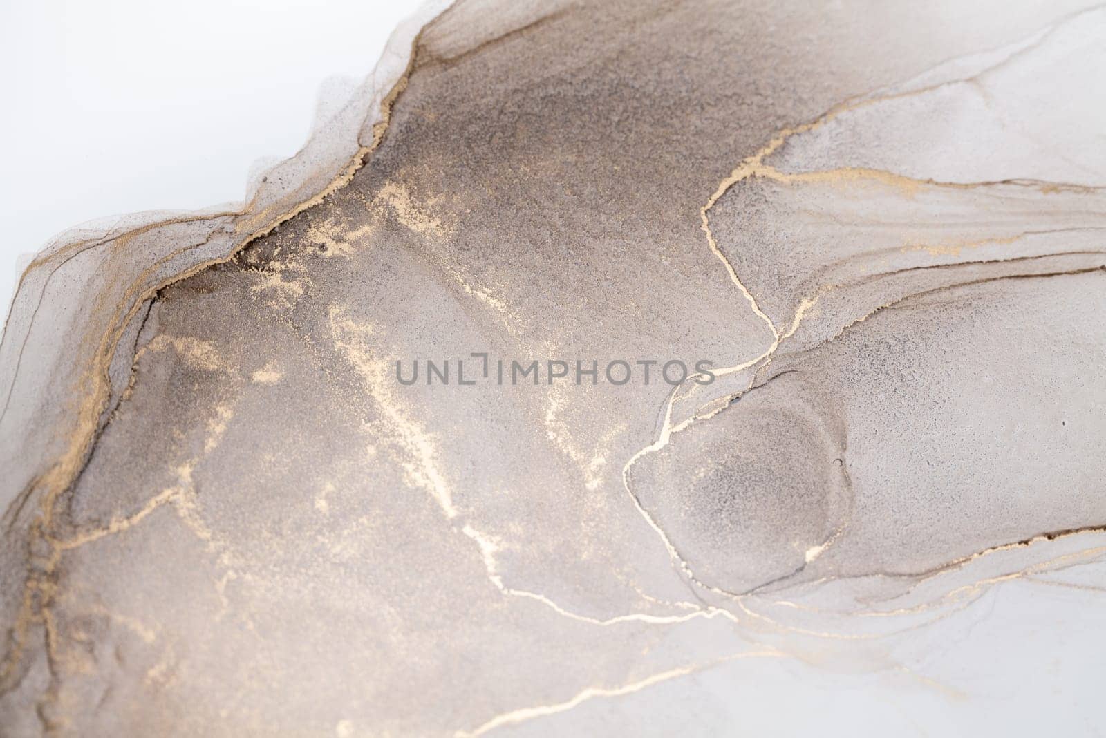 Tender and dreamy design. Luxury abstract fluid art painting in alcohol ink technique, mixture of bronze, silver, metallic and gold paints. Imitation of marble stone cut, glowing golden veins.