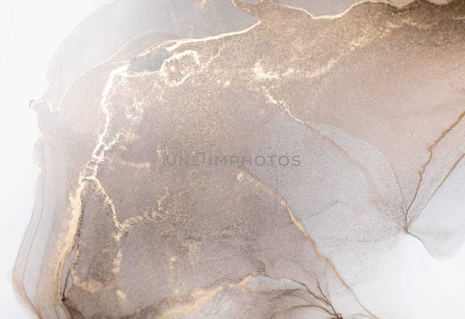 Tender and dreamy design. Luxury abstract fluid art painting in alcohol ink technique, mixture of bronze, silver, metallic and gold paints. Imitation of marble stone cut, glowing golden veins.