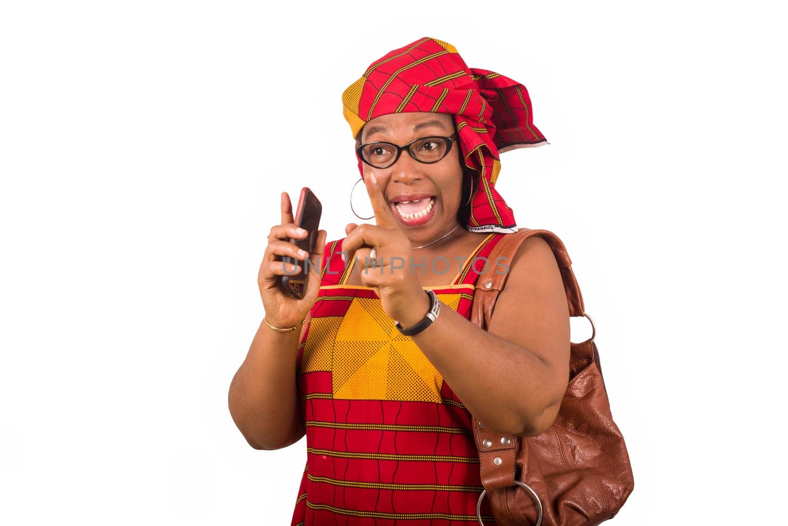 mature woman in loincloth standing on white background talking with mobile phone in hand.