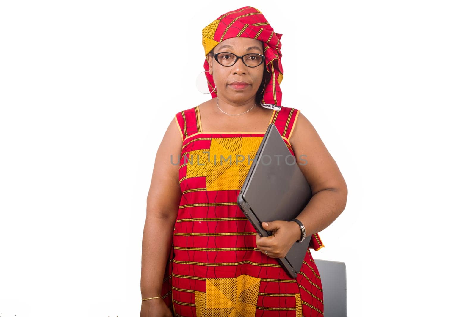 mature businesswoman standing on white background with laptop.