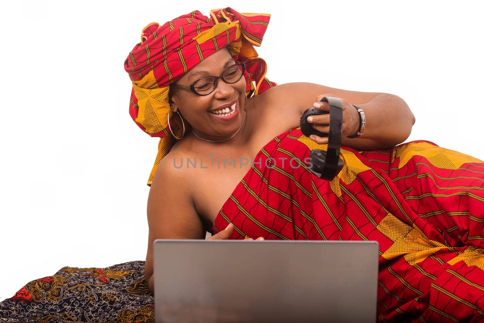 mature woman on white background watching helmets laughing.