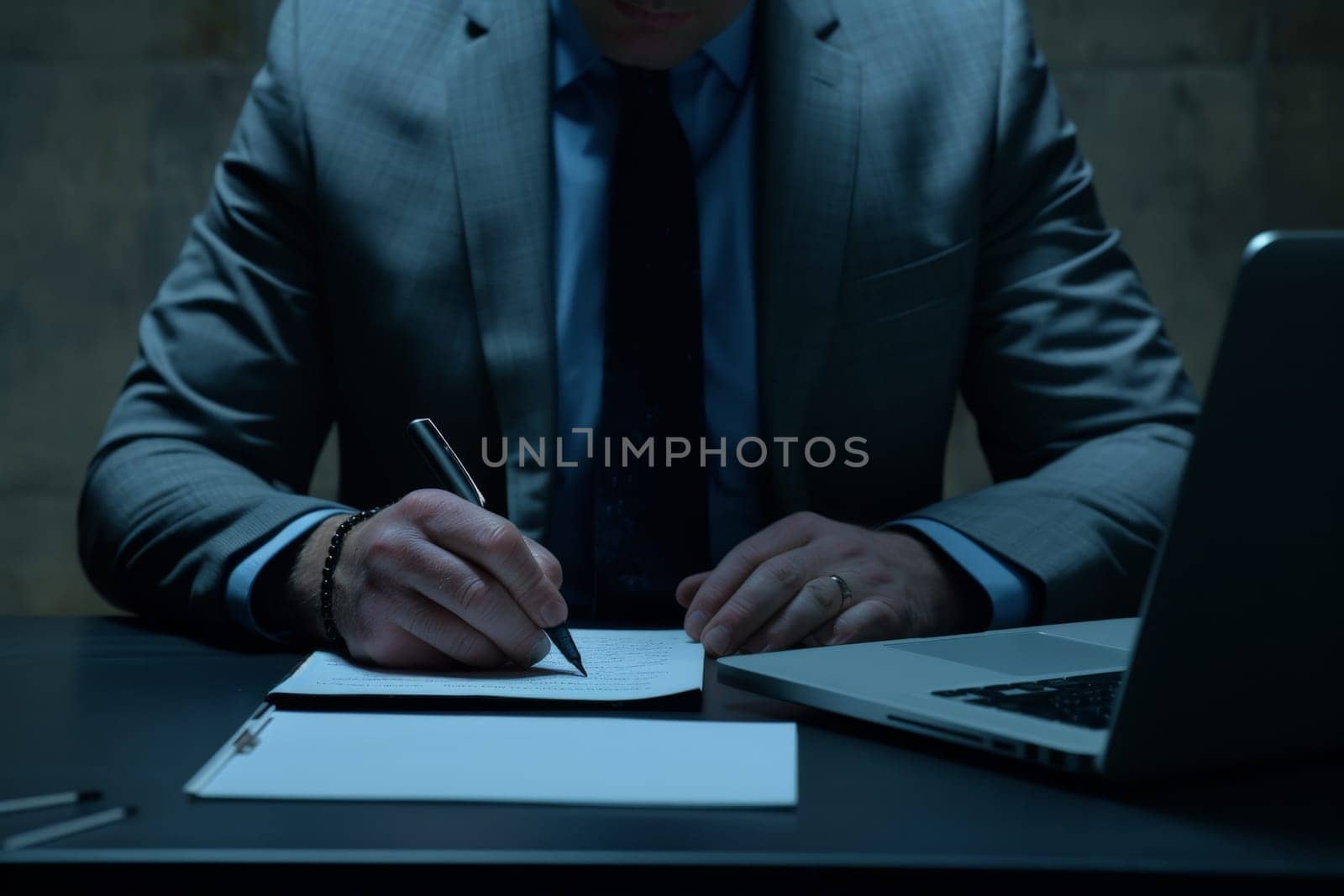 Close up hands of Businessman signing a document on desk, office background, Business concept.
