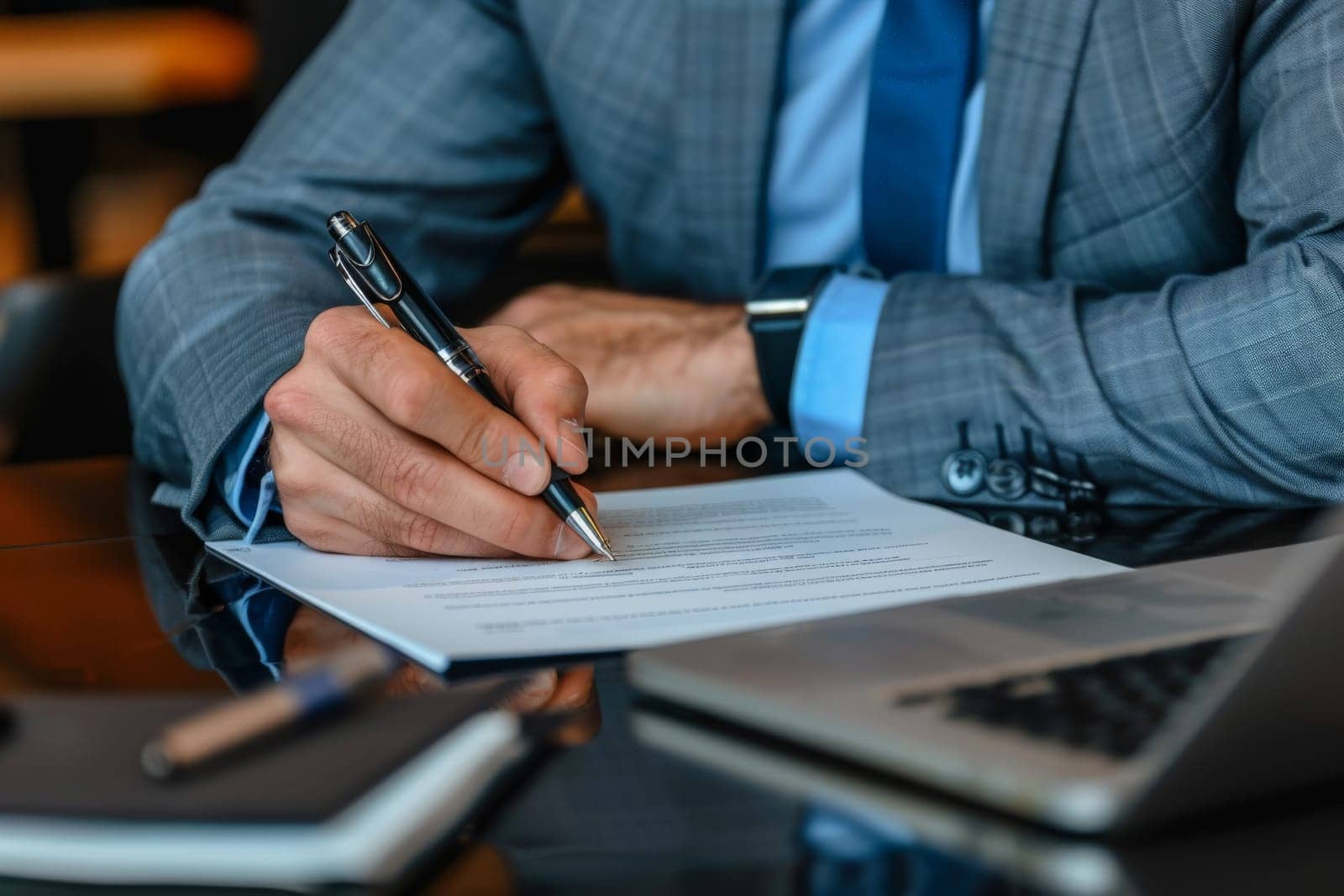 Close up hands of Businessman signing a document on desk, office background, Business concept.