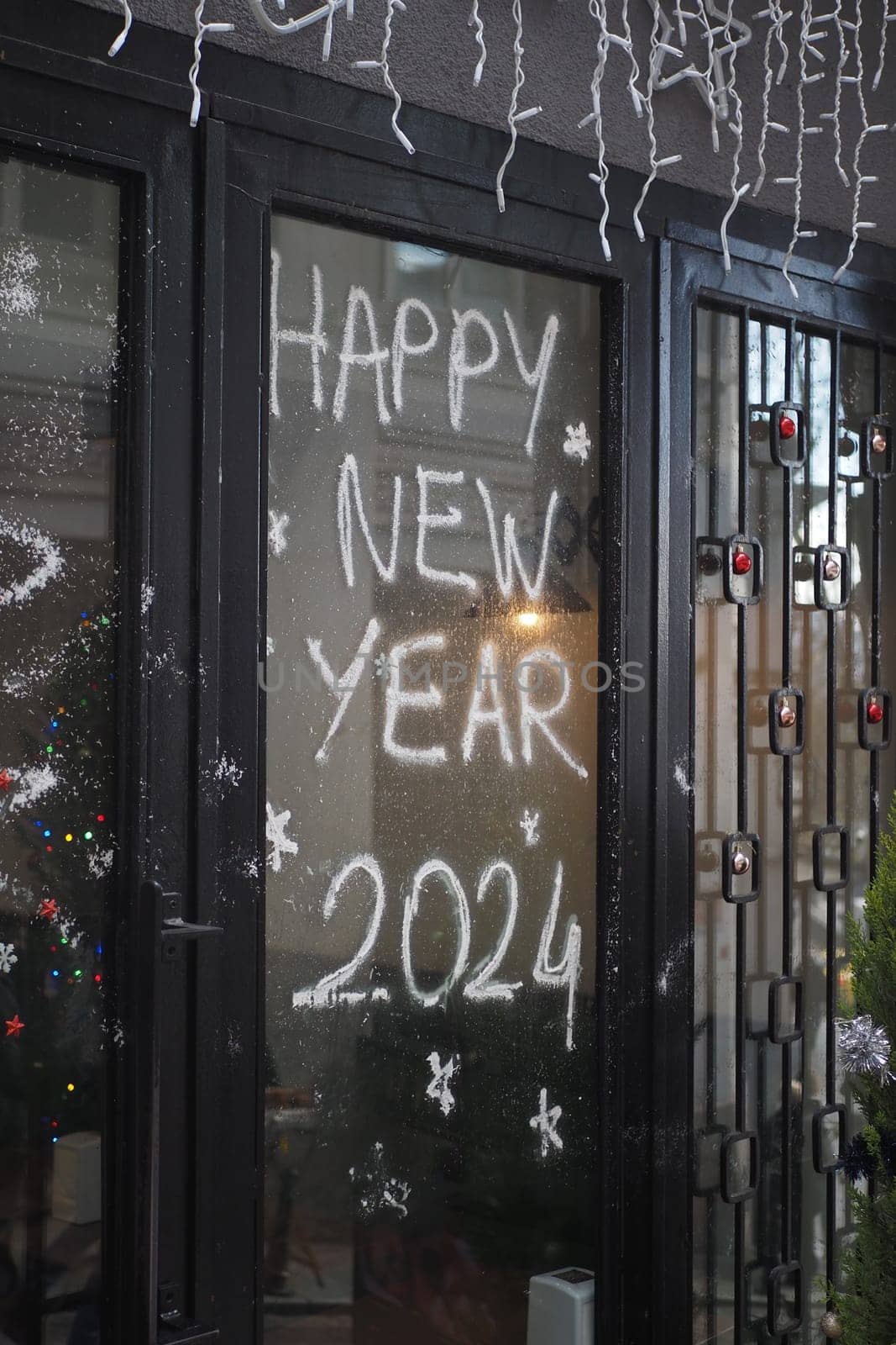 Welcome 2024 on cafe window . New year concept