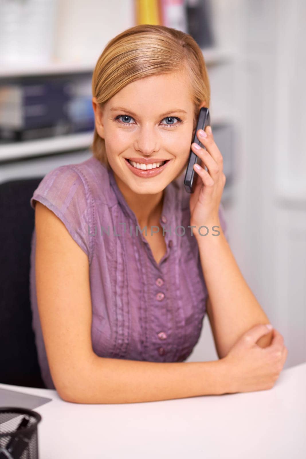 Woman, cellphone call and smile for portrait in office with contact, communication or deal at startup agency. Person, employee and mobile phone for conversation, negotiation or listening in workplace by YuriArcurs