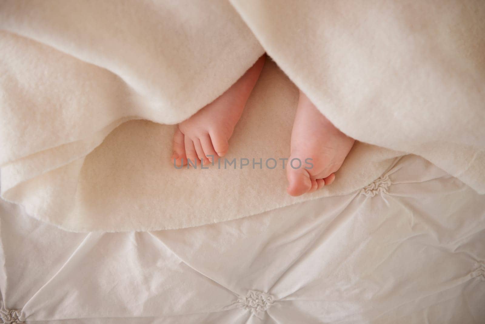 Baby, feet and toes or blanket on bed for childhood development or nursery sleeping, relax or resting. Kid, wellness and childcare as closeup for wellbeing nap or dreaming nurture, caring or calm.