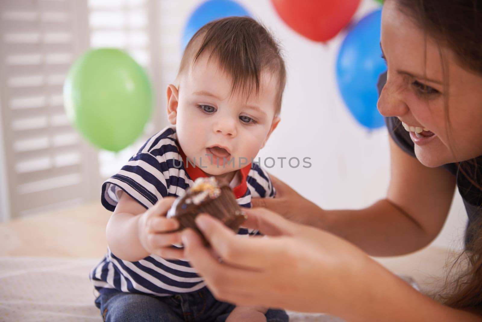 Baby, mother and birthday party with cake or balloons in home for celebration of special day, decoration or development. Child, parent and sweet dessert with accessories or event, surprise or happy.