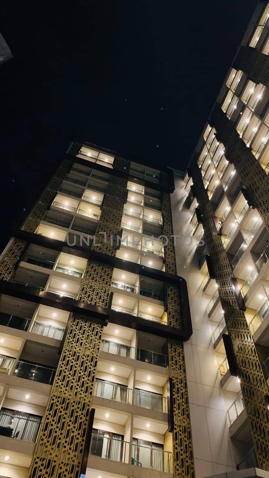 Tall building perspective during night time, business background, business template background, presentation background for your creative content creation