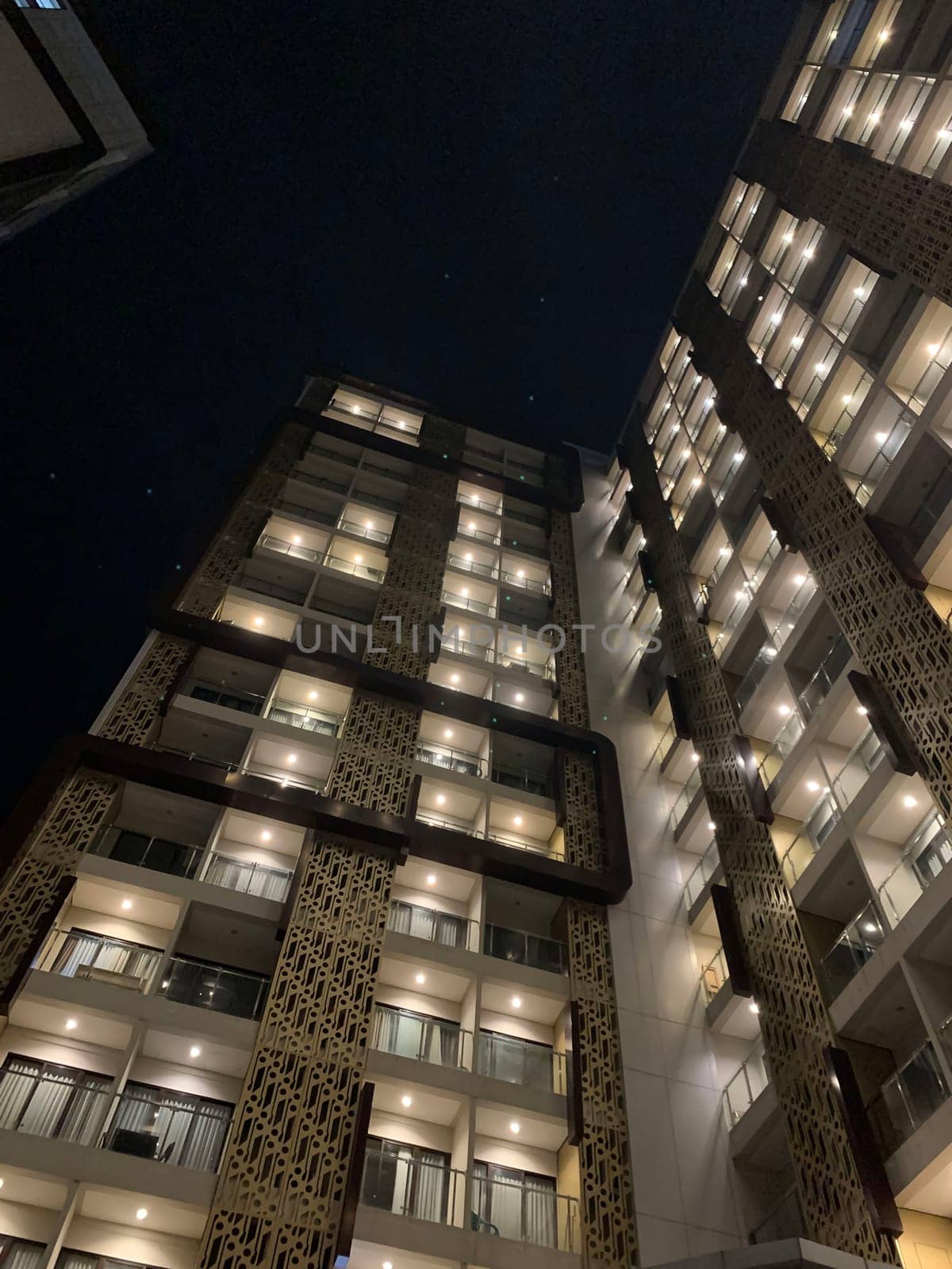 Tall building perspective during night time, business background, business template background, presentation background for your creative content creation