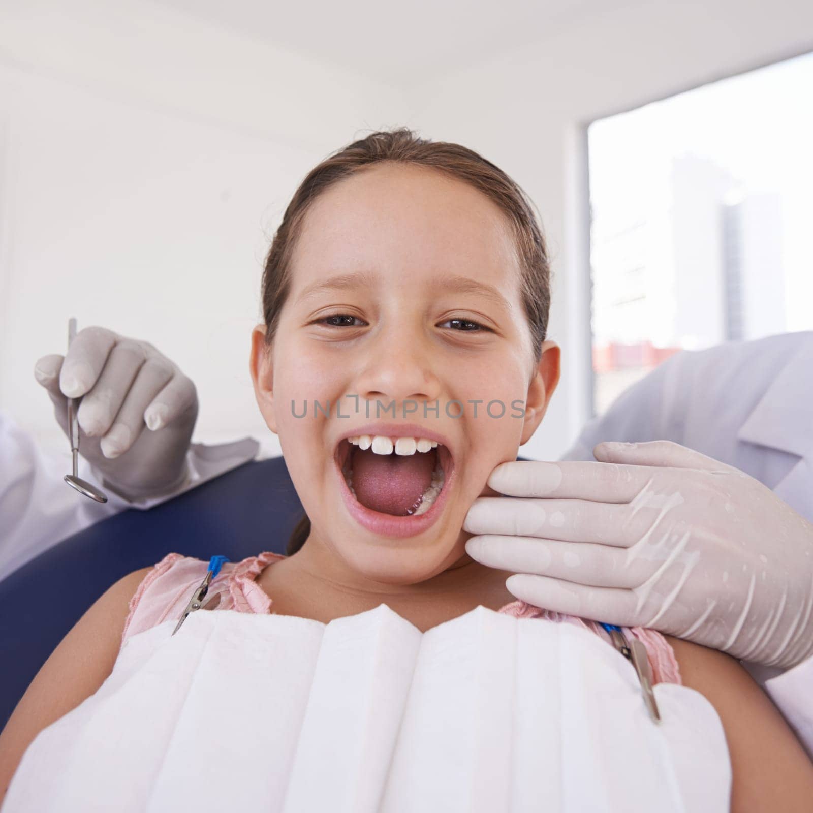 Child, mouth and portrait for dentist consultation for teeth examination for healthy oral care, whitening or cleaning. Female person, girl and face with hands for hygiene checkup, wellness or gums.