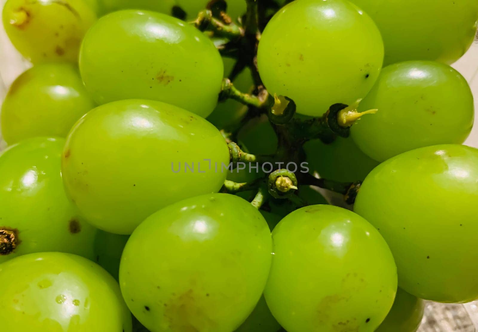 seedless green Shine Muscat grape background in a container. Japanese grapes. white grapes local produce