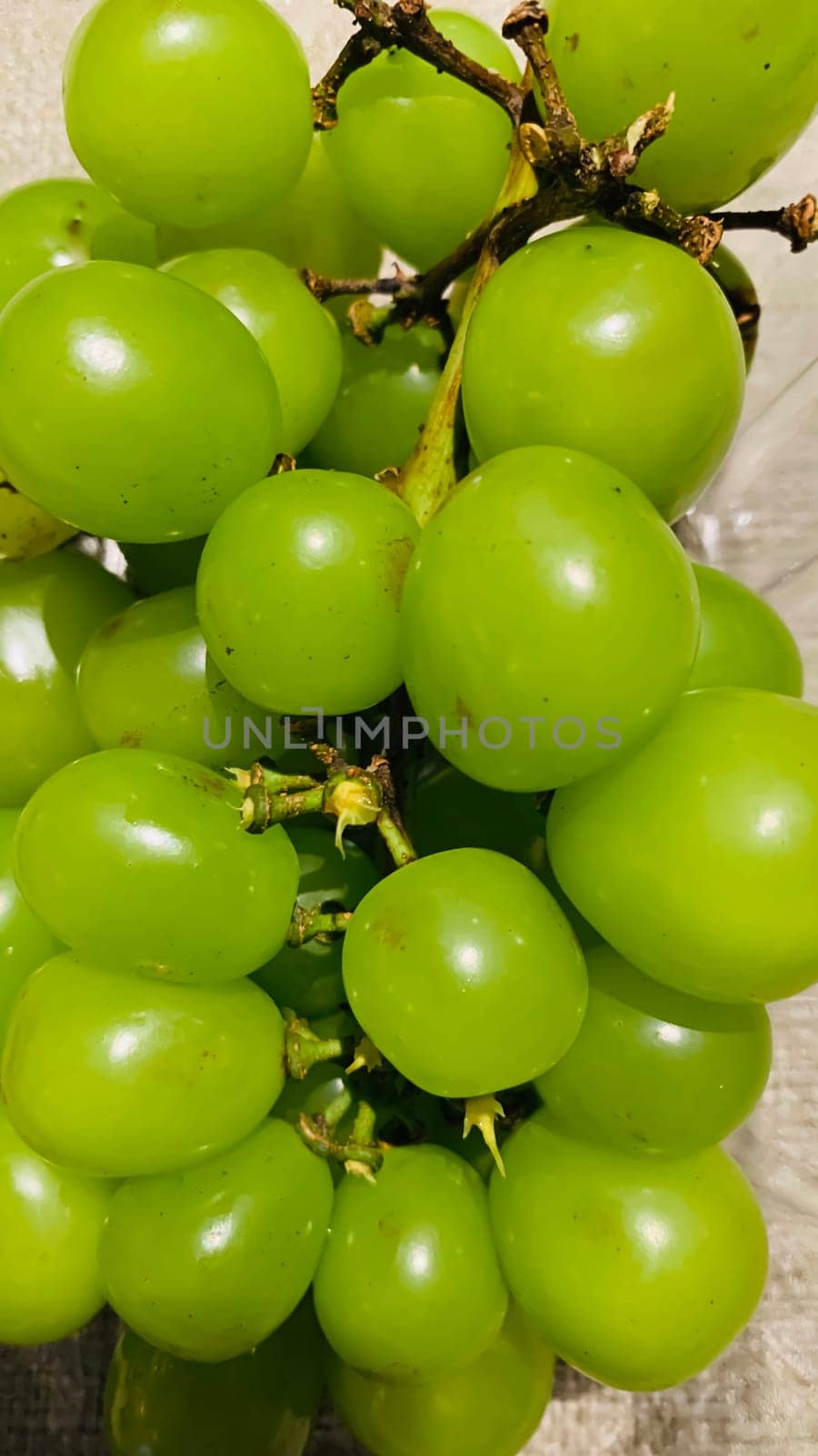 seedless green Shine Muscat grape background in a container. Japanese grapes. white grapes local produce