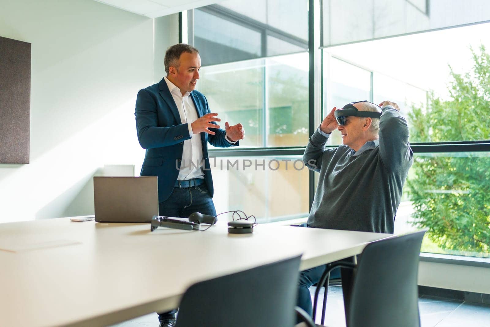 Businessmen during demo of a new mixed vision reality goggles by Huizi