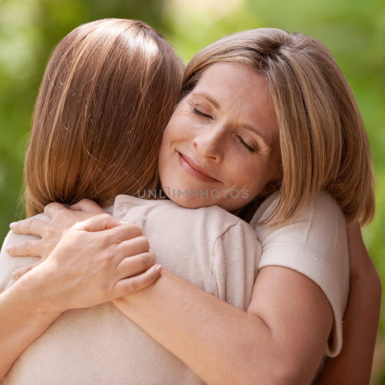 Parent, daughter and hug with support outdoors in nature for mothers day, care and affection for gratitude. Mom, girl child and bonding together on summer vacation for love, smile and closeup.