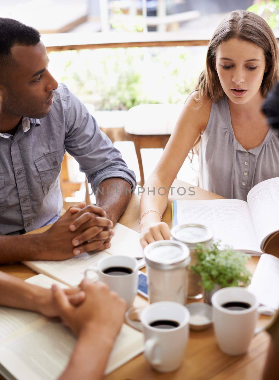 Students, teamwork and studying in coffee shop with books or friends for university education, course or learning. Man, woman and collaboration in cafe for scholarship or college degree, test or exam by YuriArcurs