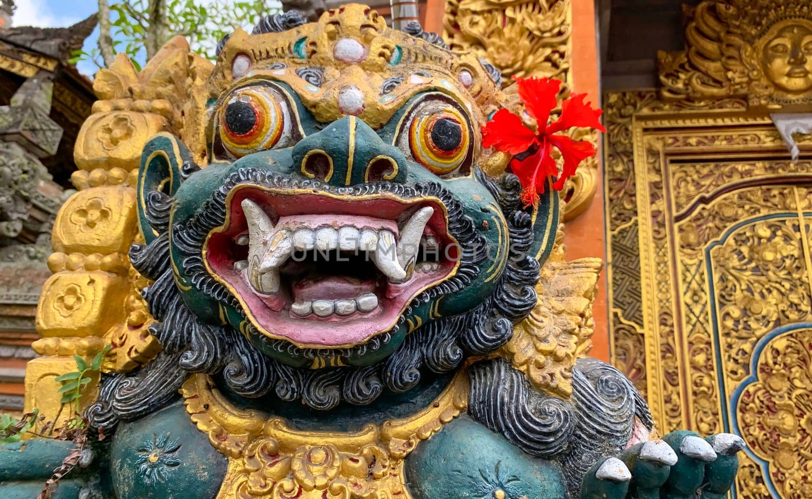 Traditional old ancient Balinese statue of demon angel called barong bali guarding sacred ritual temple of hiduism
