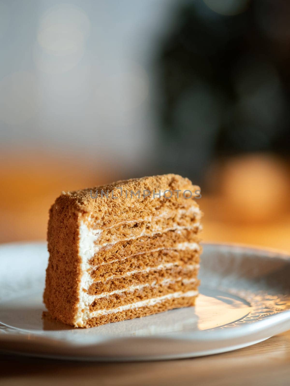 Slice of layered honey cake selective focus by fascinadora