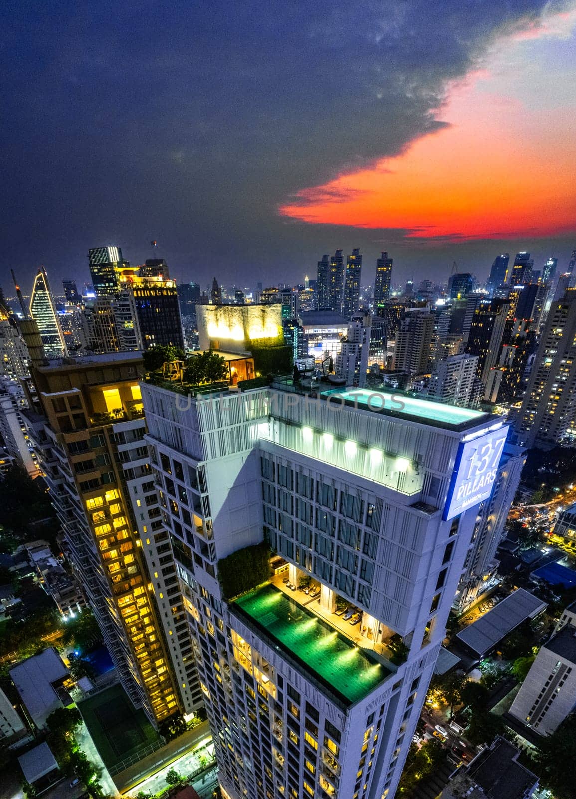 Rooftop pool with Bangkok skyline view at sunset, in Bangkok Thailand, south east asia