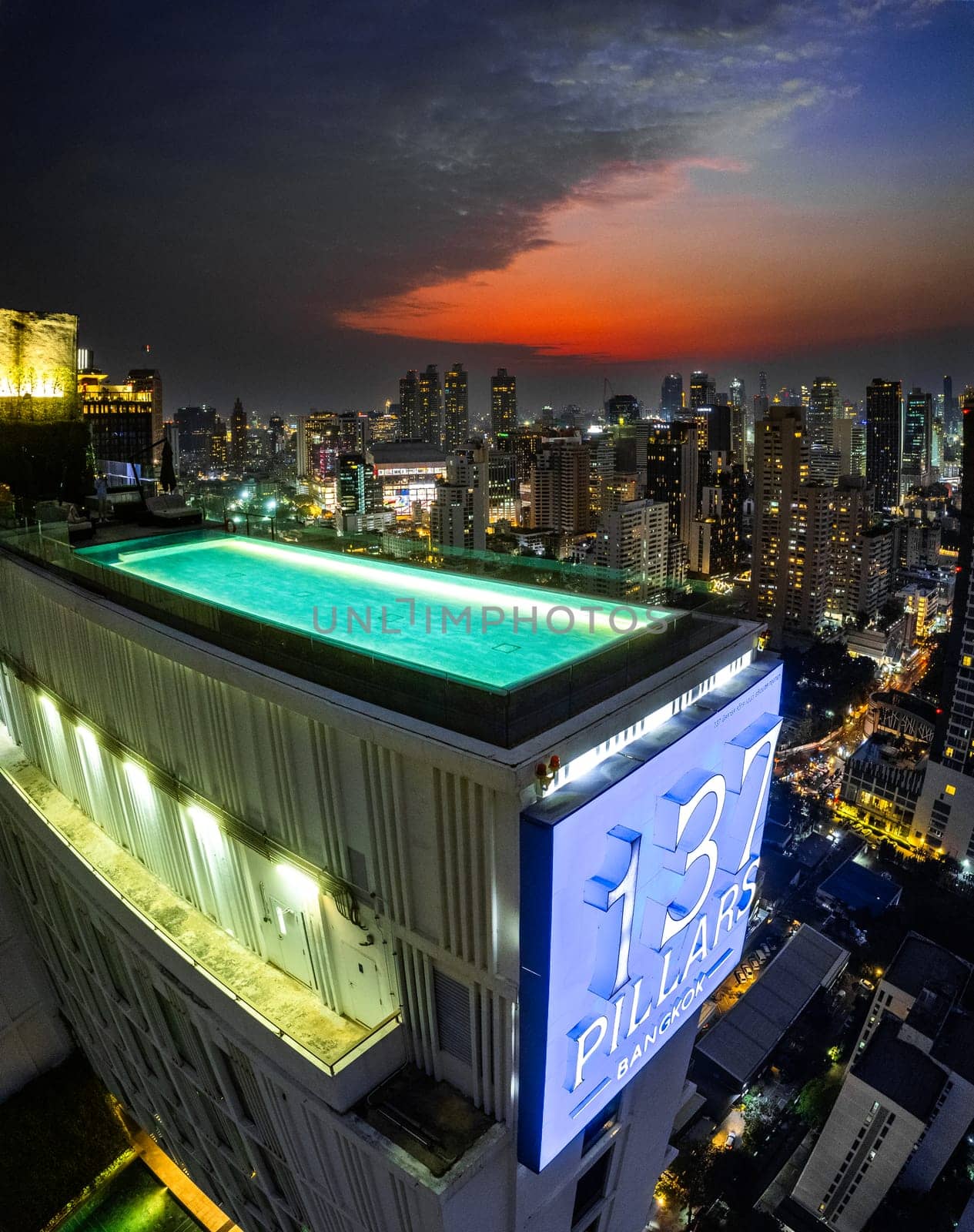 Rooftop pool with Bangkok skyline view at sunset, in Bangkok Thailand, south east asia