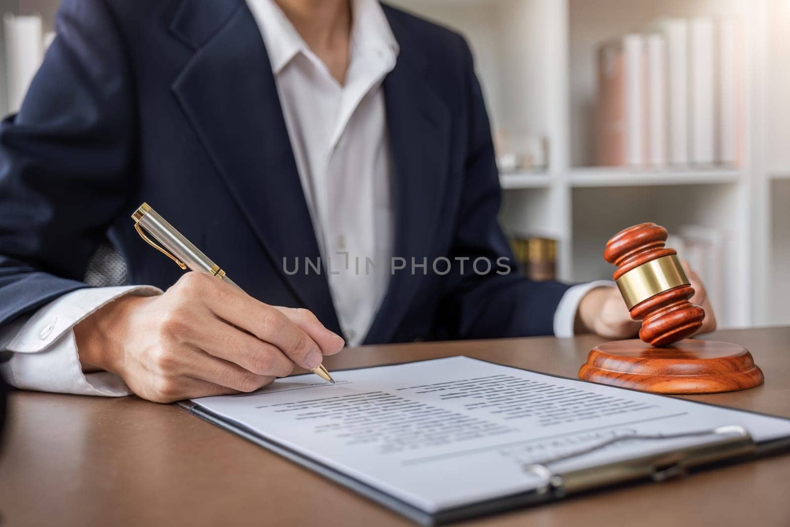 Businessman and lawyer discussing business contract document for legal advice in lawyer's office. by wichayada