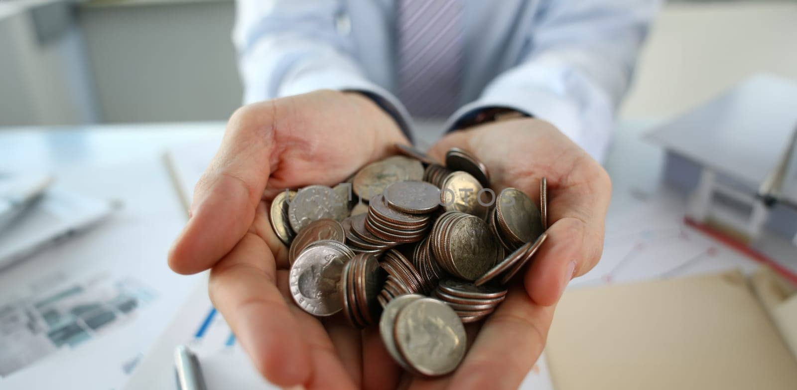 Hand businessman putting pin money by kuprevich