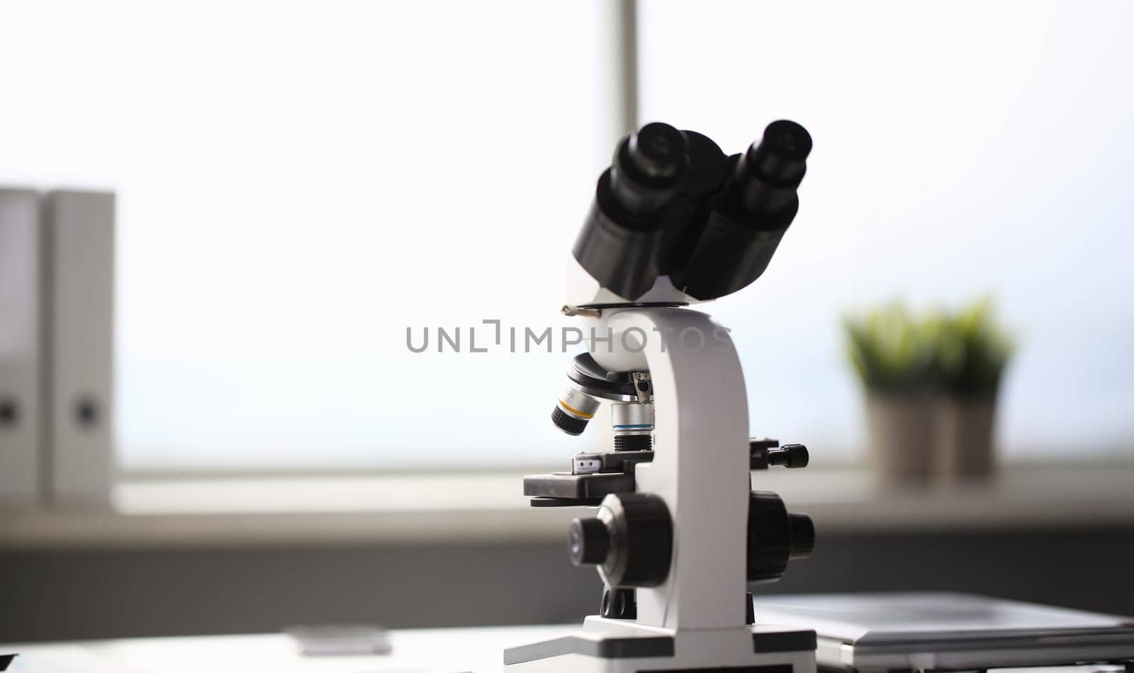 The head microscope on the background laboratory is a study human biology analyzes for non-compliance with the requirements organization public health at international level