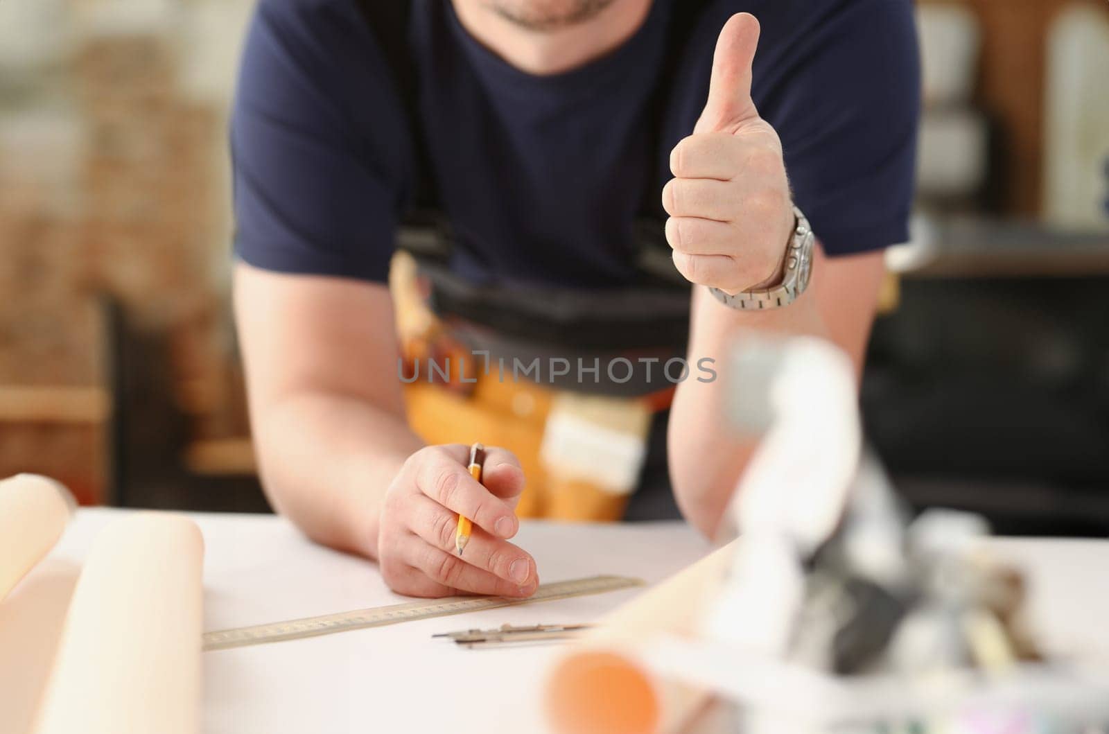 Smiling worker in yellow helmet by kuprevich