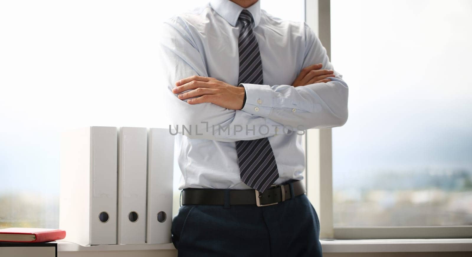 Male hands in suit crossed on chest closeup background. White collar dress code modern office lifestyle graduate college study profession idea coach train election participation concept