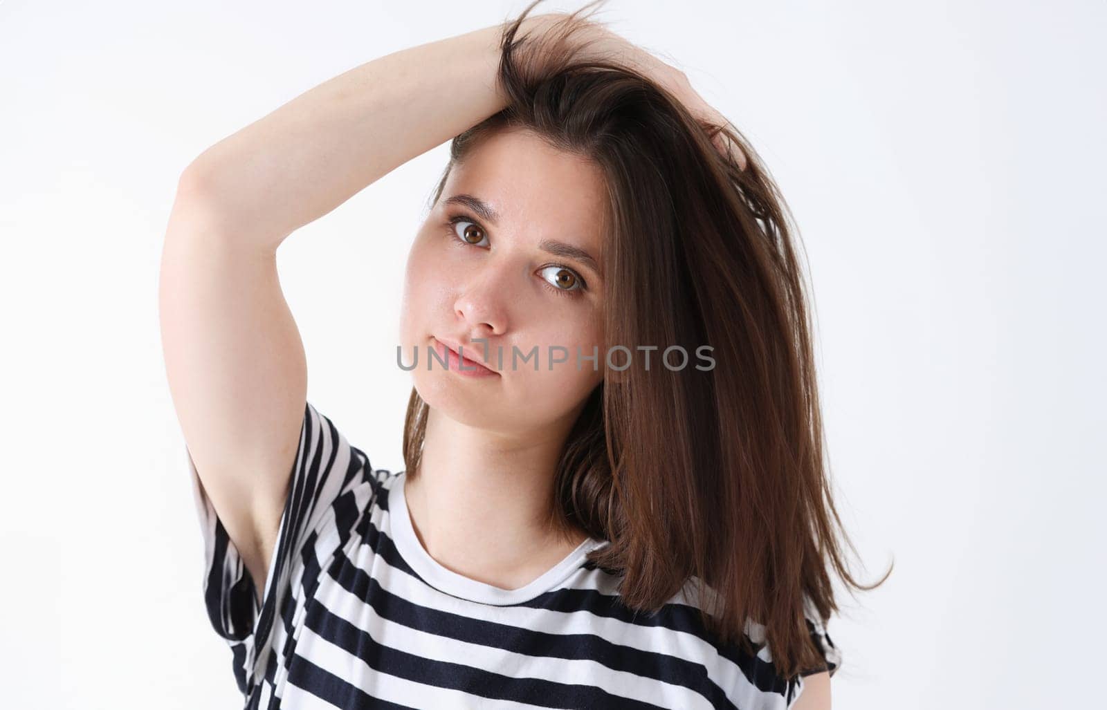 Fashion model woman face large portrait on a gray background