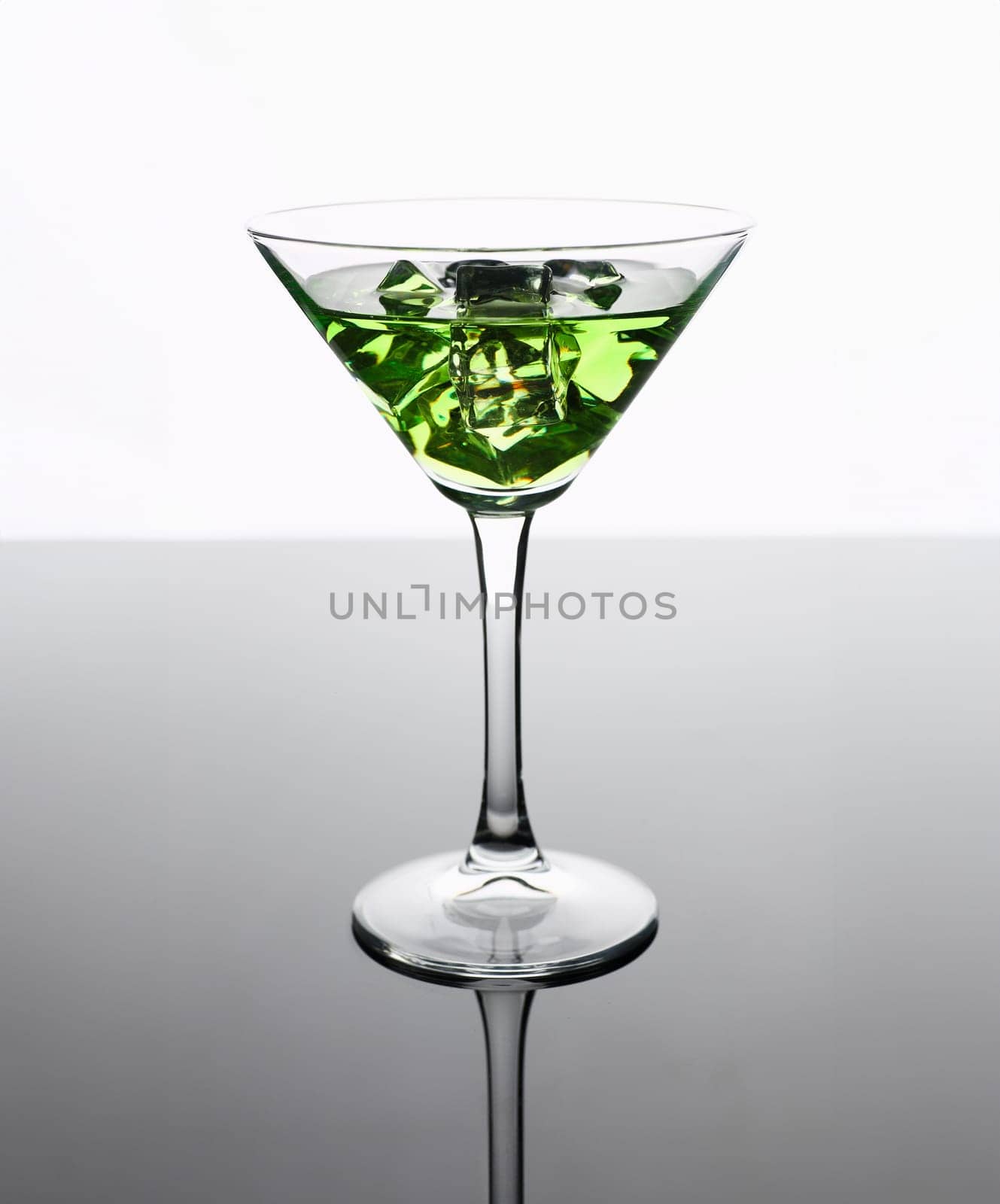 Cocktail absinthe with vodka in martini glass by kuprevich