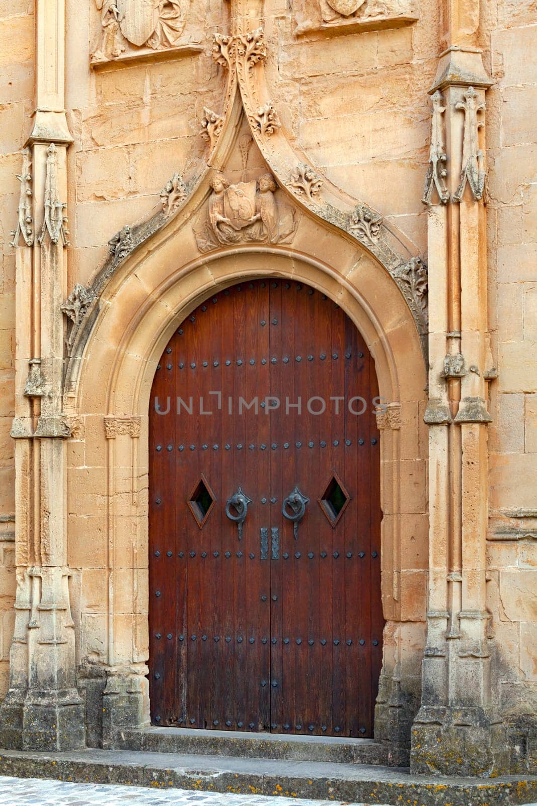 Gothic wooden door in the Gothic style of the old cathedral.