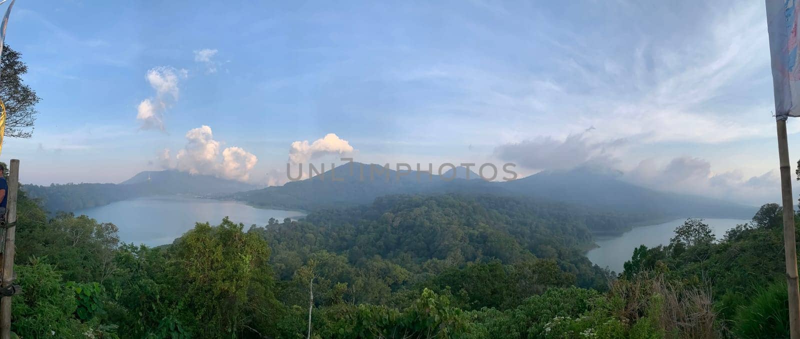 beautiful panorama of beautiful countryside of twin lake in bali. sunny afternoon. wonderful springtime landscape in mountains. grassy field and rolling hills. rural scenery